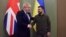 British Prime Minister Boris Johnson (left) shakes hands with Ukrainian President Volodymyr Zelenskiy in Kyiv on April 9.