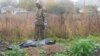 Місце масового поховання на Харківщині: поліція ексгумувала тіла семи українських військових