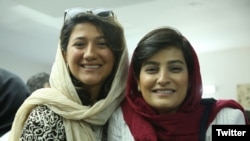 Reporters Nilufar Hamedi (left) and Elahe Mohammadi helped break the story of Mahsa Amini, whose death in police custody sparked outrage in Iran. (file photo)