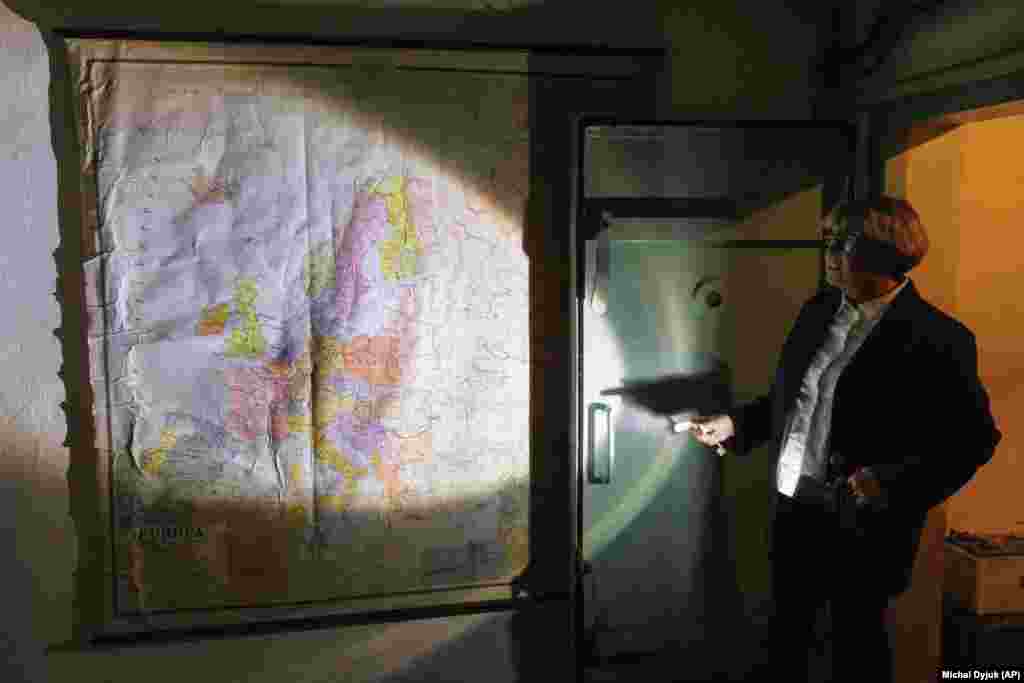 Ewa Karpinska, a spokesperson for ArcelorMittal, shows a map from the Cold War-era at the shelter under the plant. Following Russian President Vladimir Putin&rsquo;s thinly veiled threats about his willingness to deploy tactical nuclear weapons against Ukraine, &ldquo;everyone is worried,&rdquo; Karpinska said.&nbsp; &nbsp;