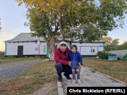 Ardak Yerkibulanov, 42, pictured with his daughter, is one of 1,200 Altynalmas workers facing potential redundancy. He is the third generation in a family of miners.