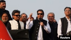 Pakistan's former Prime Minister Imran Khan addresses supporters in Lahore on October 28.