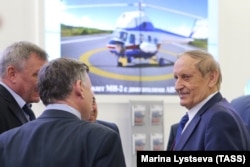 Vyacheslav Bohuslayev (right) attends a helicopter industry exhibition outside Moscow in 2017.