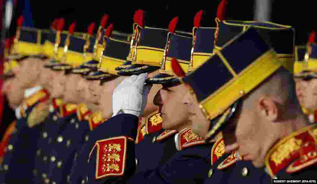 A soldier adjusts his hat during celebrations marking Romania&#39;s Army Day celebrations in Bucharest.&nbsp;