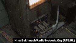 Iryna says she lucky she still has a wood burner that her family can use for warmth this winter, if their heating fails.