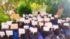Students at Iran's Al-Zahra University take part in a sit-in protest on October 31 against the suspension of fellow students for taking part in protests that have spread across the country. 