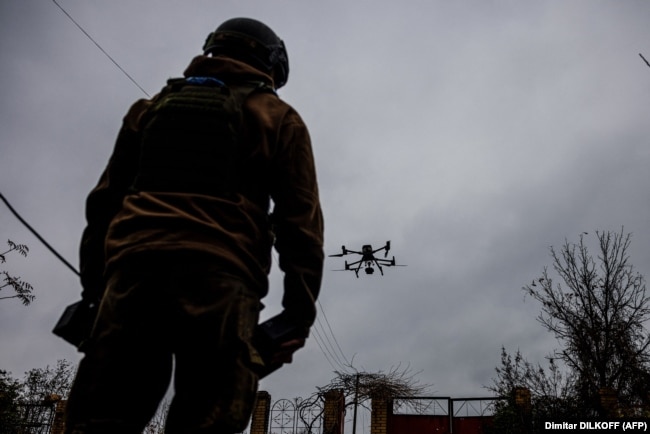 A Ukrainian soldier launches a drone in eastern Ukraine's Donetsk region on October 30.