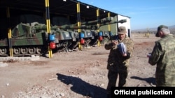 Turkey - An Armenian officer (L) inspects a Turkish military base near Kars, 28Nov2012. 