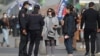 Armenia - Police officers talk to women not wearing mandatory masks on a street in downtown Yerevan, November 2, 2021.