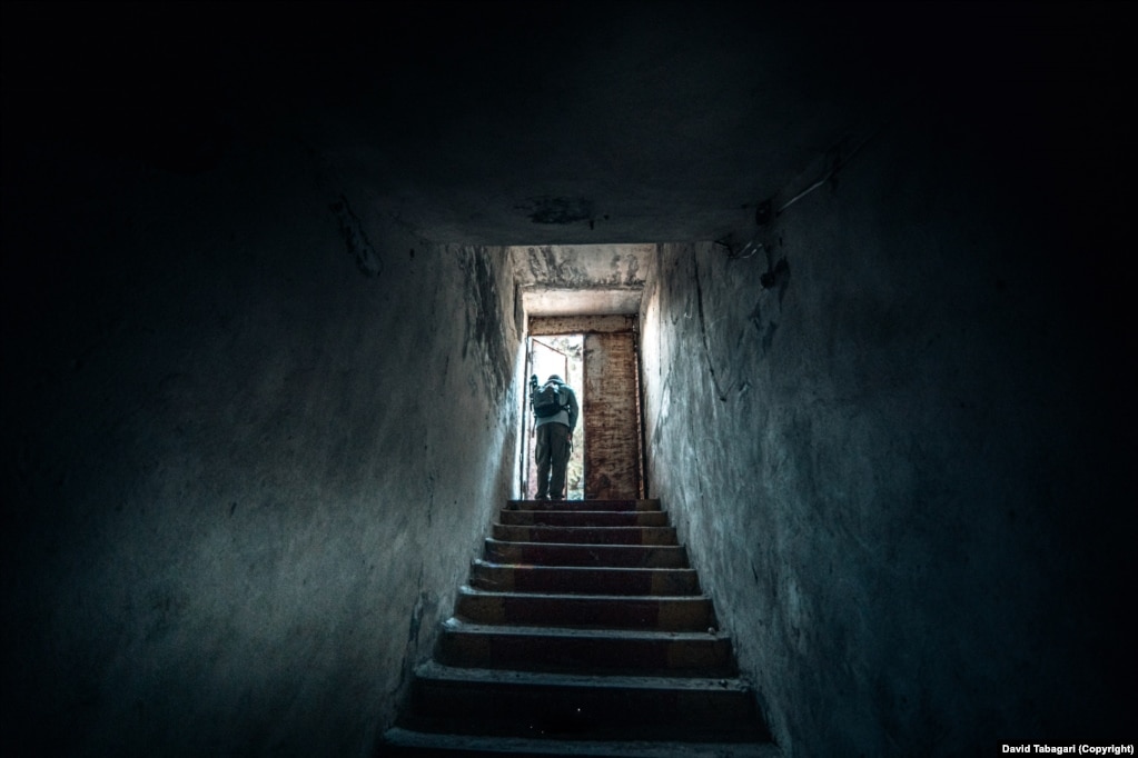 A digger steps into the street after a session in Tbilisi’s underground network.