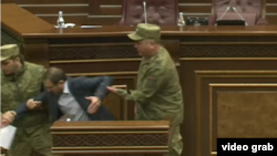 Armenia - Security officers remove opposition deputy Gegham Manukian from the parliament podium, Օctober 26, 2021.