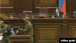 Armenia - Security officers remove opposition deputy Gegham Manukian from the parliament podium, Օctober 26, 2021