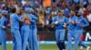 India's Virat Kohli (C) celebrates with teammates after he took a catch to dismiss South Africa's Quinton de Kock for seven runs during their Cricket World Cup match at the Melbourne Cricket Ground (MCG) February 22, 2015. REUTERS/Brandon Malone (AUST