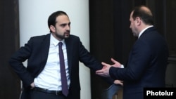 Armenia - Deputy Prime Minister Tigran Avinian (left) and Defense Minister Davit Tonoyan talk before a cabinet meeting in Yerevan, April 9, 2020.