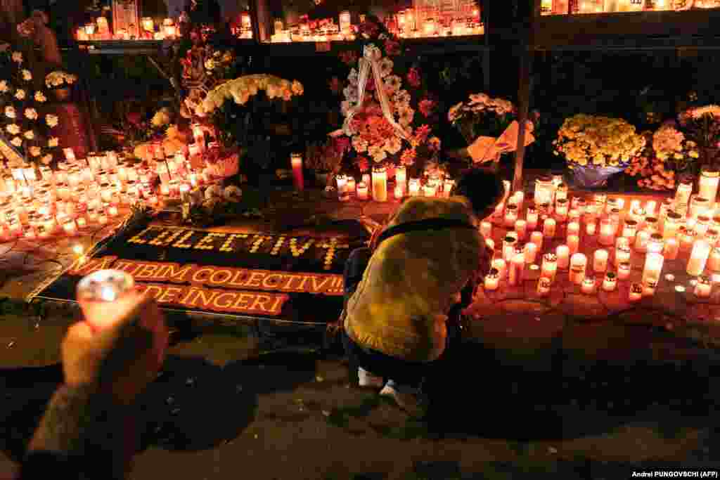 People light candles during a vigil in memory of the victims of the Colectiv nightclub fire in Bucharest. On October 30, 2015, 64 people died and hundreds were injured inside the Bucharest club during a fire that triggered a wave of anti-corruption protests and a nationwide debate about administrative incompetence, bribery, and safety standards.