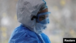 A doctor wearing personal protective equipment is seen in the intensive care unit at City Clinical Hospital No. 52 in Moscow.