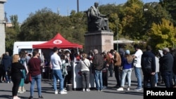 Armenia - People line up outside a mobile vaccination center in Yerevan's Liberty Square, September 24, 2021.