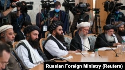 Members of the Taliban delegation, including its head Abdul Salam Hanafi (third from right) and acting Foreign Minister Amir Khan Muttaqi (center), take part in international talks on Afghanistan in Moscow on October 20.
