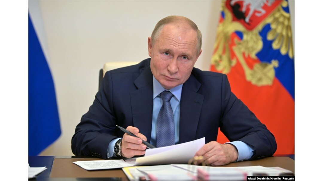 Russian President Vladimir Putin chairs a meeting with senior government officials via a video link at his residence outside Moscow on October 20.