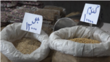 Iran - bags of grain at a food market - food prices have skyrocketed along with inflation - screen grab