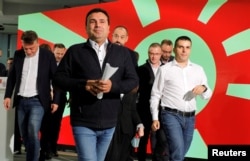 Zoran Zaev, who resigned after his party lost the second round of mayoral elections, leaves a news conference in Skopje on October 31.