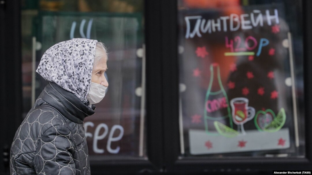 A woman walks in central Moscow amid the surging pandemic. The country will go into a nationwide workplace shutdown in the first week of November in an effort to combat the coronavirus.