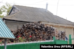 Wood stacked near a home in Talmaza.