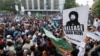 Supporters of the Islamist political party Tehrik-e Labaik Pakistan (TLP) carry flags and placards during a protest in Karachi on October 24.