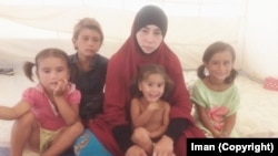 Крымчанка Иман со своими детьми в Сирии, 2017 год