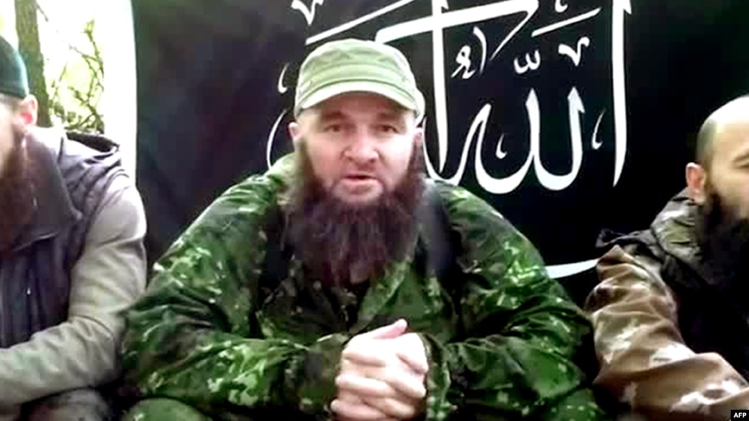 A screen grab of video posted in July 2013 shows Doku Umarov (center) at an undisclosed location. 