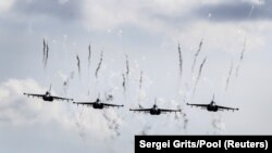 Belarusian military jets fly during the Zapad 2017 war games near the village of Volka, Belarus, on September 19.