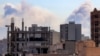 Plumes of smoke rise following reported explosions in Tehran on March 3. 