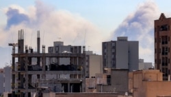Plumes of smoke rise following reported explosions in Tehran on March 3. 
