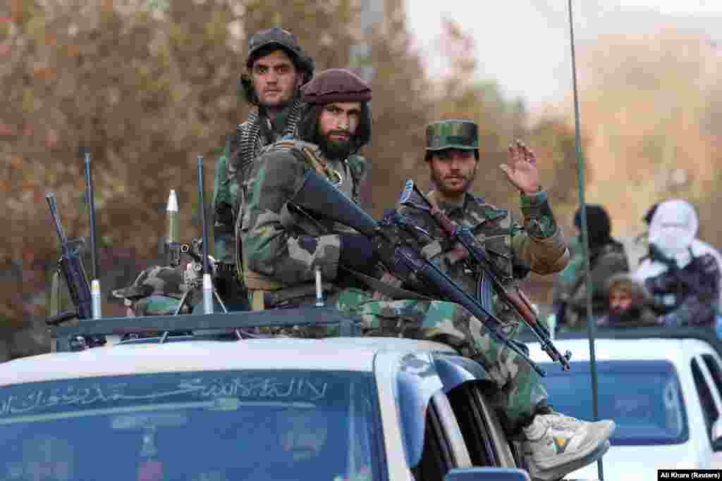 Members of the Taliban sit on a vehicle during a military parade in Kabul, Afghanistan.&nbsp;