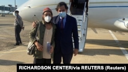 New Mexico Governor Bill Richardson (right) poses for a picture with American journalist Danny Fenster following his release from prison in Myanmar in an undated picture posted on Twitter in November 2021.