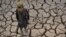 A child walks over parched land in the Bala Murghab district of Badghis Province on October 15. 