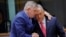 Slovak Prime Minister Robert Fico (left) speaks with his Hungarian counterpart, Viktor Orban, at an EU summit in Brussels earlier this year. 