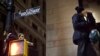 Protesters affiliated with the Occupy Wall Street movement kiss while standing atop a bus stop during an unannounced raid by the New York City Police Department outside Zuccotti Park in New York on November 15. (REUTERS/Andrew Burton)