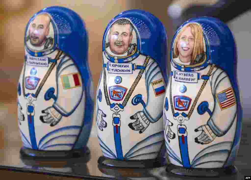 Russian nesting dolls -- called Matryoshka dolls -- depict the ISS crew members (left to right) Italian astronaut Luca Parmitano, Russian cosmonaut Fyodor Yurchikhin, and U.S. astronaut Karen Nyberg, on November 11, 2013. 
