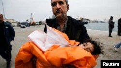 A Syrian refugee arriving on the Greek island of Lesbos