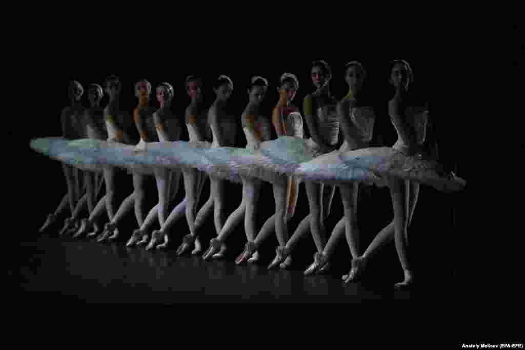 Ballet dancers perform during a rehearsal of Swan Lake in St. Petersburg.