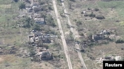 Ukrainian soldiers enter the village of Robotyne in this screengrab taken from a handout video released on August 25, 2023.