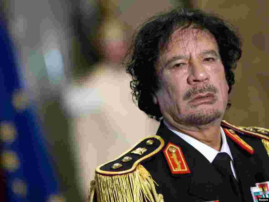 Qaddafi looks on during a news conference in Rome on June 10, 2009.