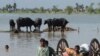 Pakistan - Pakistani people shift their belongings in the flooded area of Dera Allah Yar, a city of the Jaffarabad district of Balouchistan. 12Sep2012.