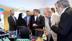 International Atomic Energy Agency (IAEA) Director General Rafael Grossi (center) visits Iran's nuclear achievements exhibition in Tehran in April. 