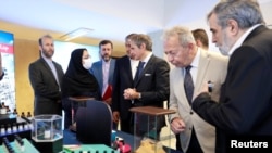 International Atomic Energy Agency (IAEA) Director General Rafael Grossi (center) visits Iran's nuclear achievements exhibition in Tehran in April. 