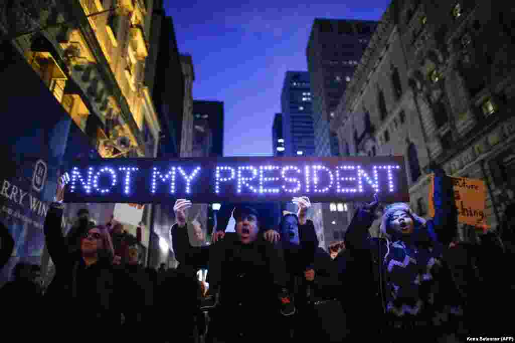 Demonstrators protest against U.S. President-elect Donald Trump in front of Trump Tower in New York City on November 12, four days after his surprise victory in the presidential election. (AFP/Kena Betancur)