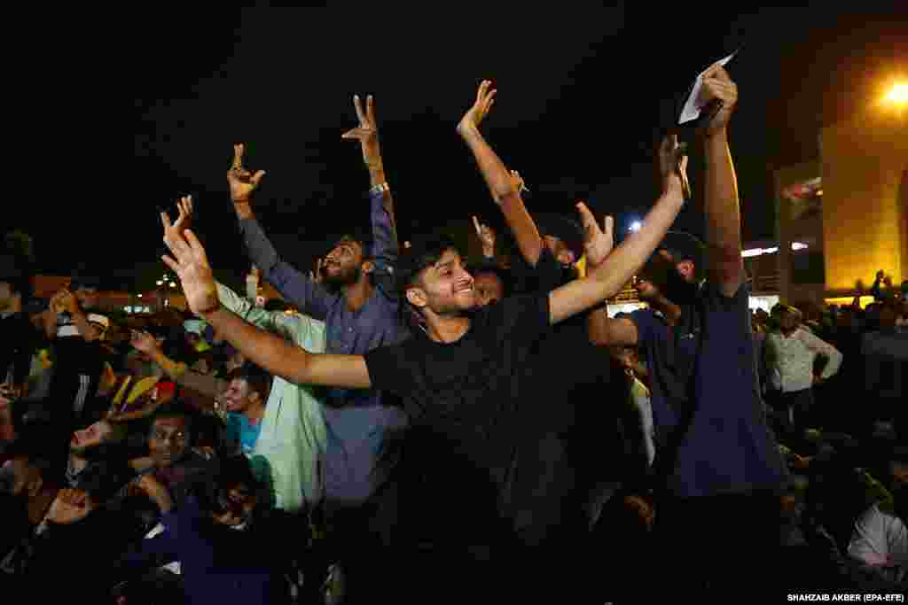 Pakistani cricket fans in Karachi watch the live broadcast of the Asia Cup cricket match between India and Pakistan.