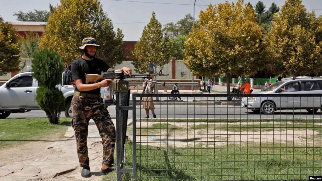 A Taliban fighter stands guard after a blast in front of the Russian Embassy in Kabul in September.