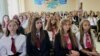 Belarus -- schoolchildren han to watch the "open lesson" by Lukashenka